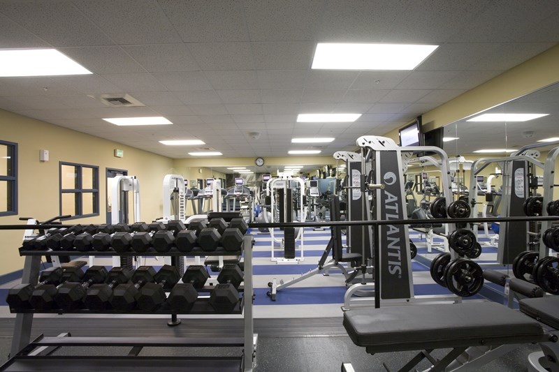 a gym full of weights and other exercise equipment