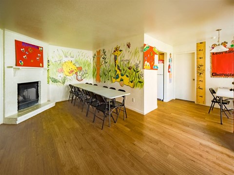 a dining room with a table and chairs and a fireplace