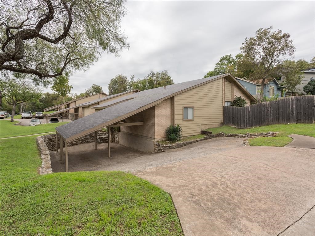 a house with a driveway and a parking lot