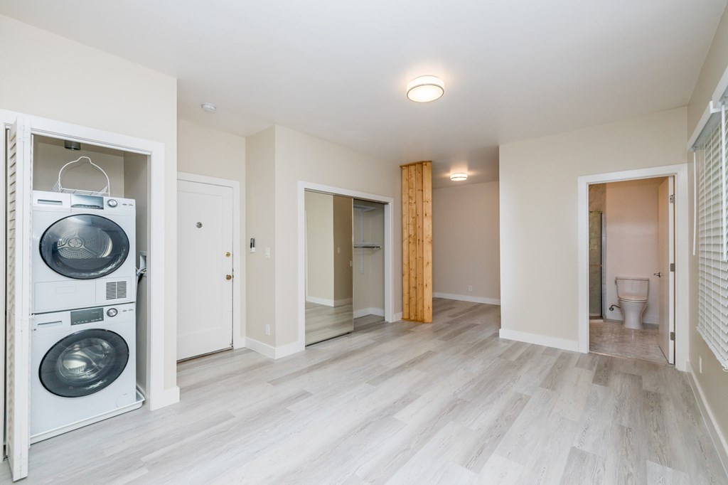 a laundry room with a washer and dryer in a renovated house