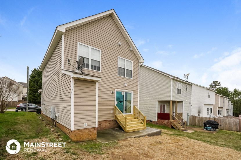 the exterior of a house with a porch and stairs
