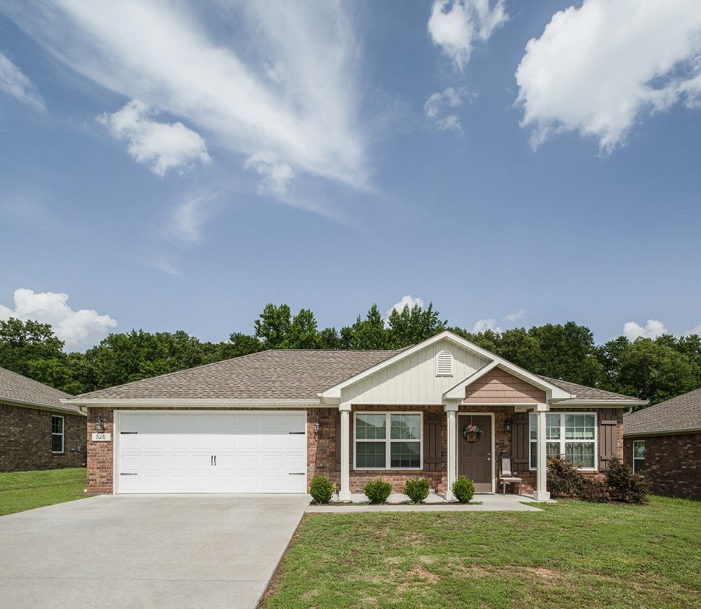 a house with a driveway and a garage door