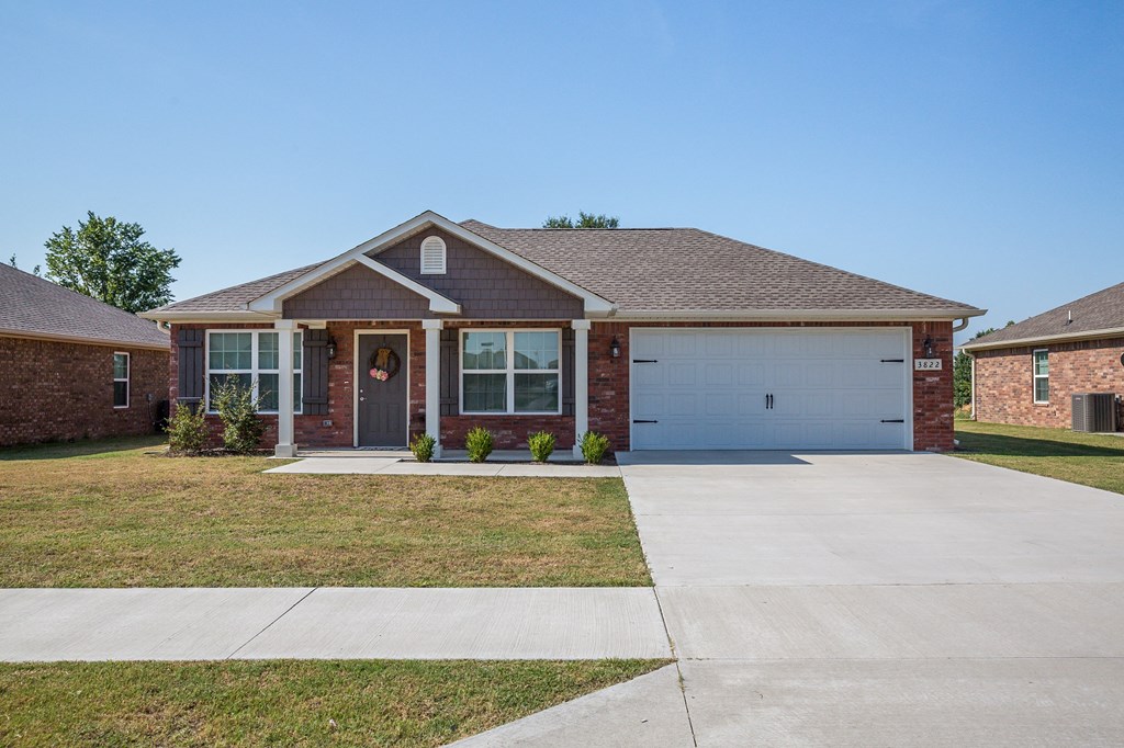 a house with a driveway and a garage door