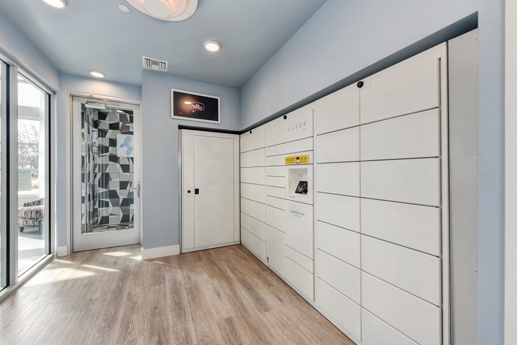 Luxer Package receiving system room with Hardwood Inspired Floor and Window at Morgan Ranch Apartments, California, 95037