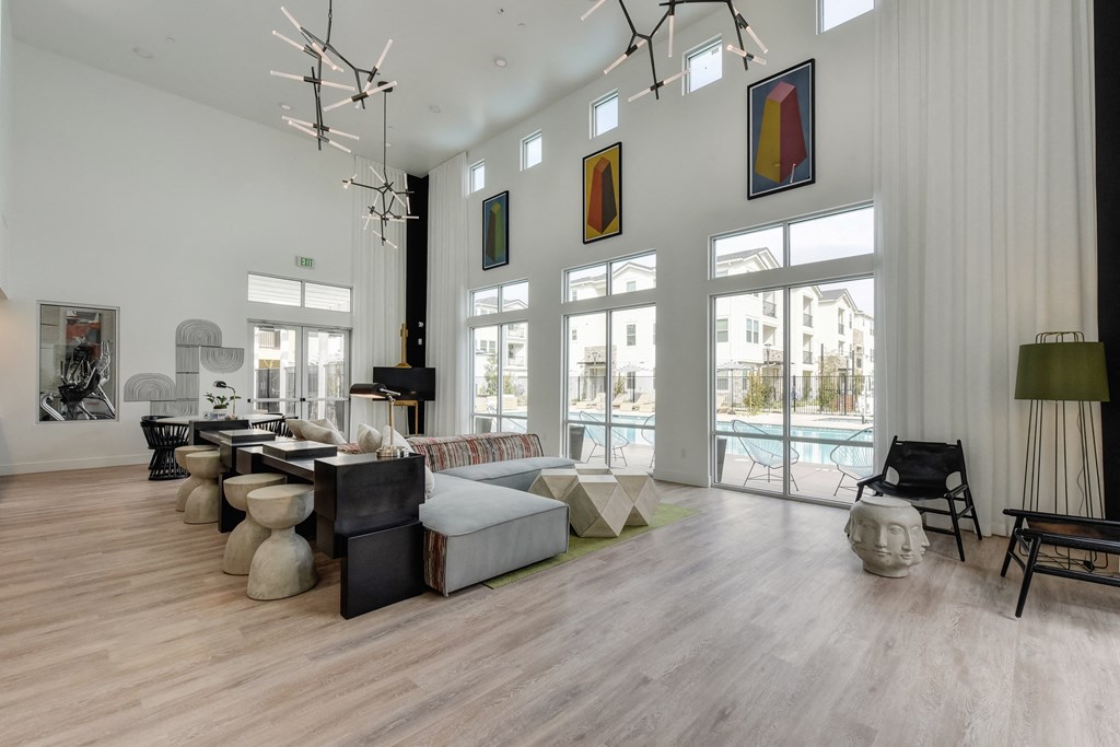 Community Clubhouse with round white table, black chairs, Hardwood Inspired Floor at Morgan Ranch Apartments, Morgan Hill, 95037