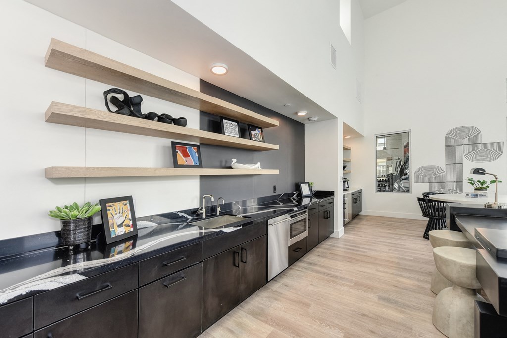 Clubhouse with Black Countertop, Hardwood Inspired Floor at Morgan Ranch Apartments, Morgan Hill, CA, 95037