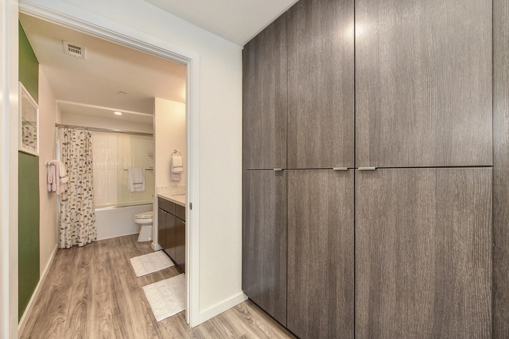 Bathroom with wall of cabinets from floor to celing at Morgan Ranch Apartments, California, 95037