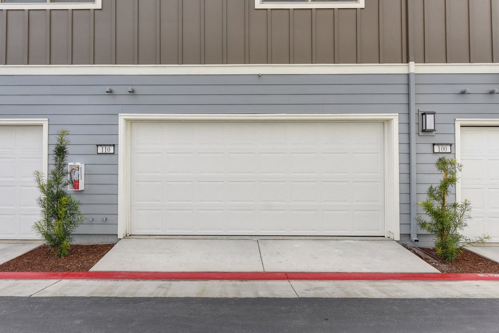 Exterior of the driveway and two car garage at Morgan Ranch Apartments, California