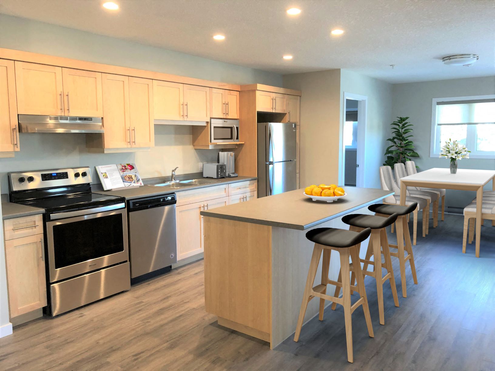 a kitchen with a center island and a table with chairs