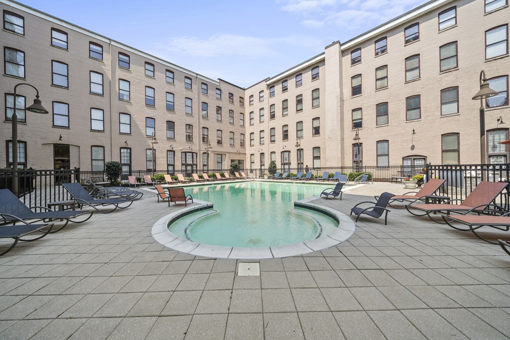 a swimming pool in the middle of an apartment building