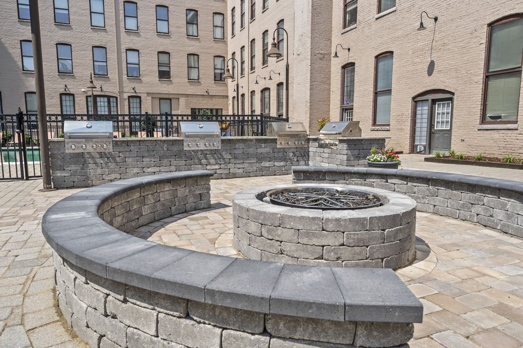 a stone fire pit in the middle of a building