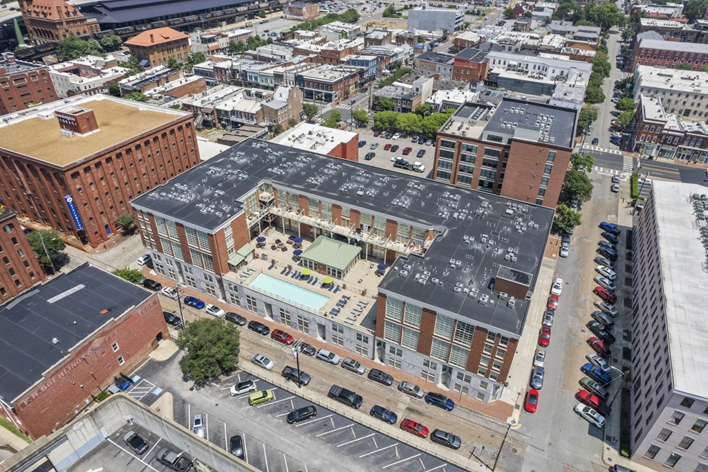 an aerial view of a building with a black roof