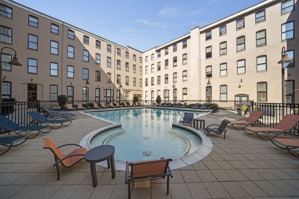 a large swimming pool in the middle of an apartment building
