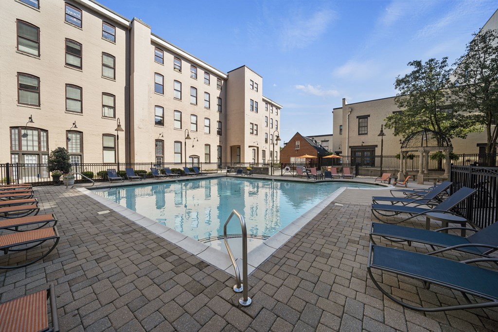 our apartments have a large pool and lounge chairs