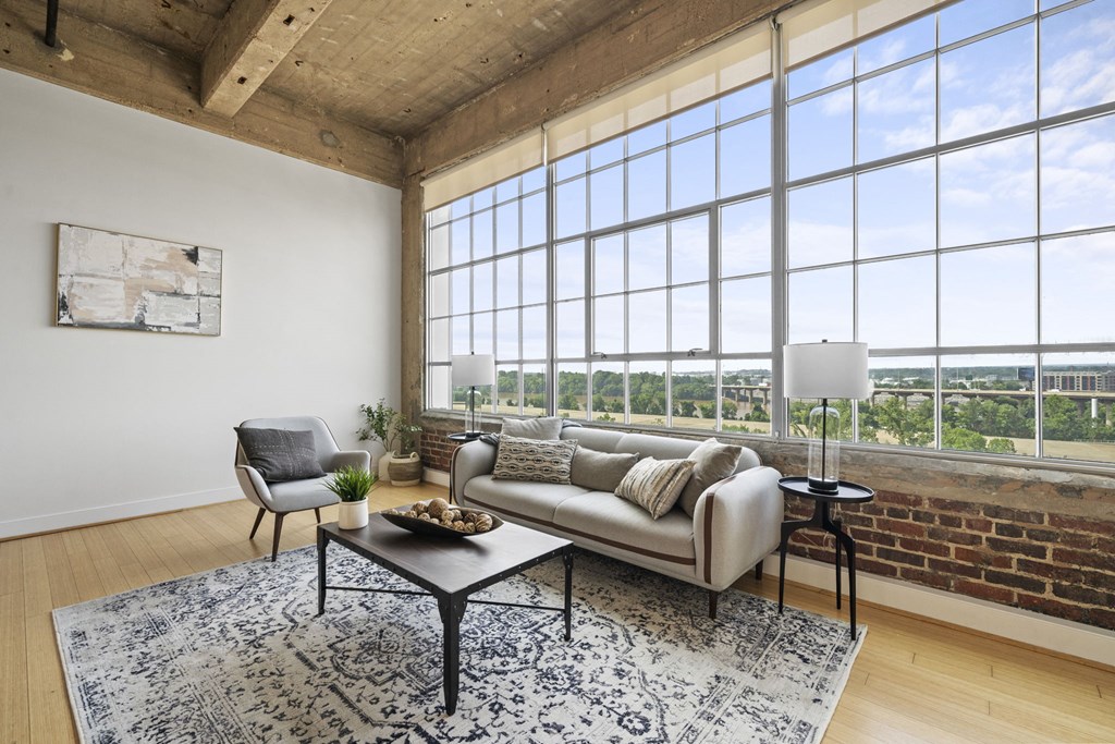 a living room with a couch and a large window