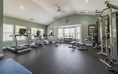 fitness center with treadmills and strength equipment