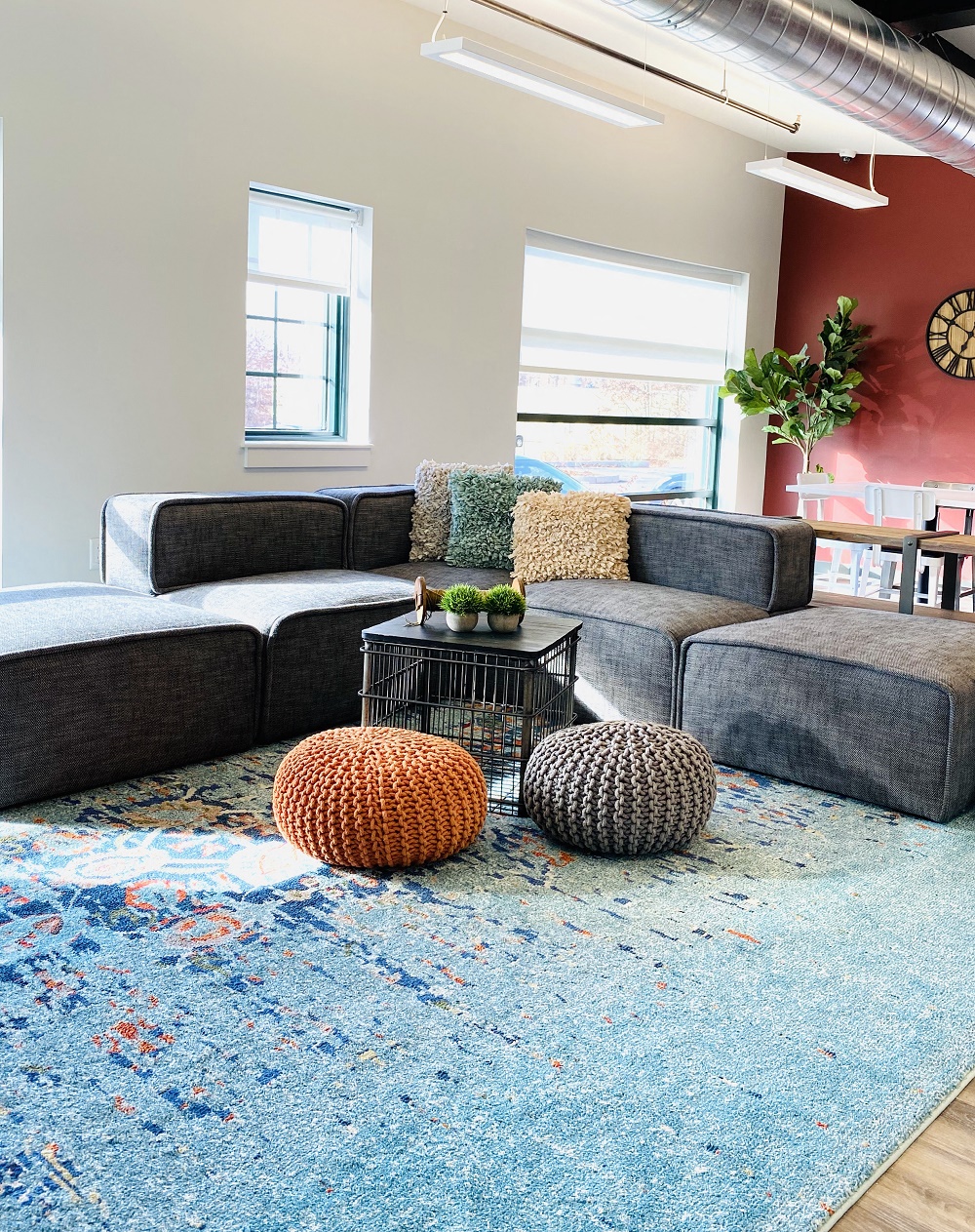 a living room with a couch and a rug