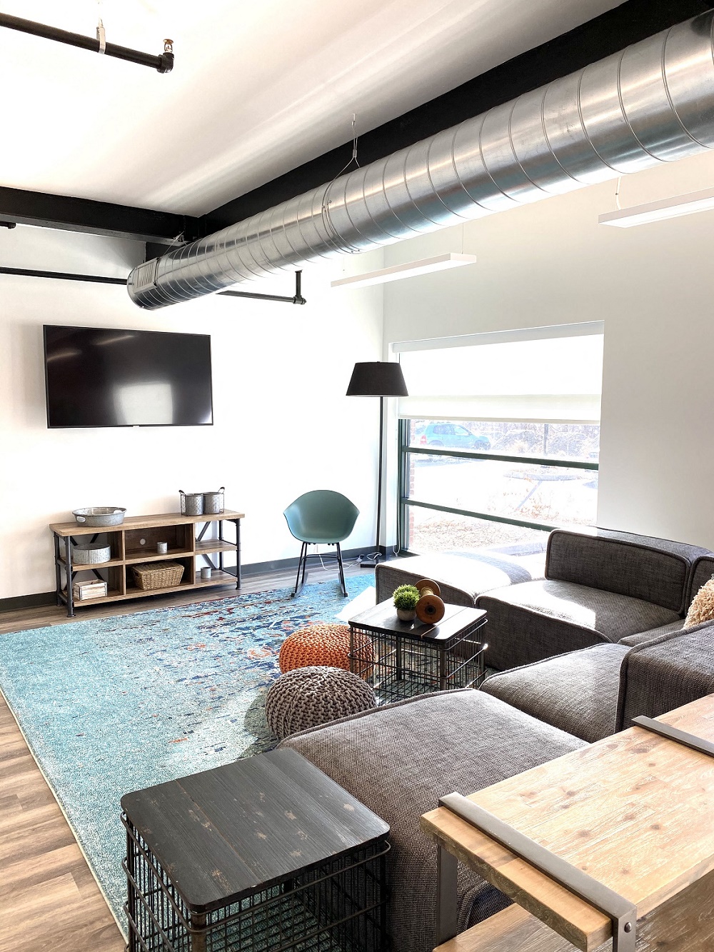 a living room with a couch and a table and a television