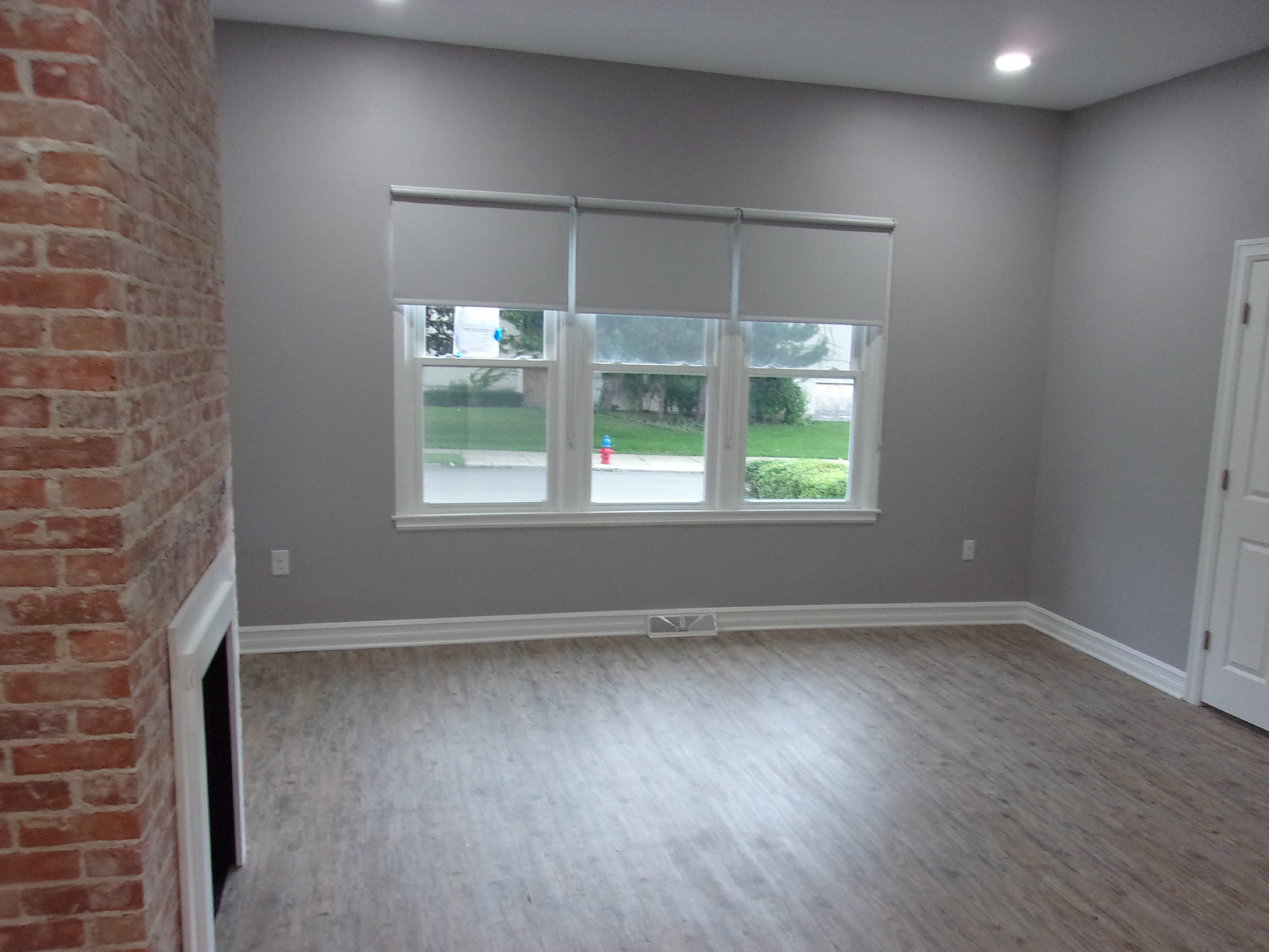 Spacious Living Room New Flooring Fireplace