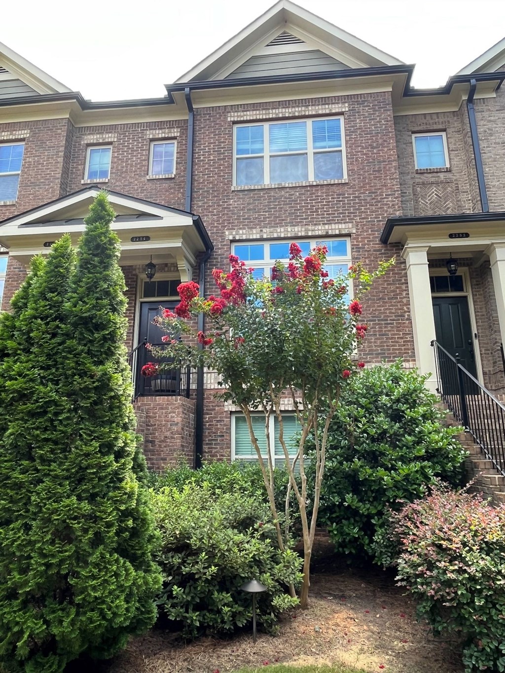 a house with a garden in front of it