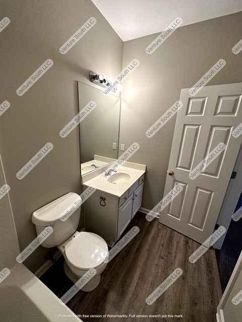 a small bathroom with a toilet and a sink