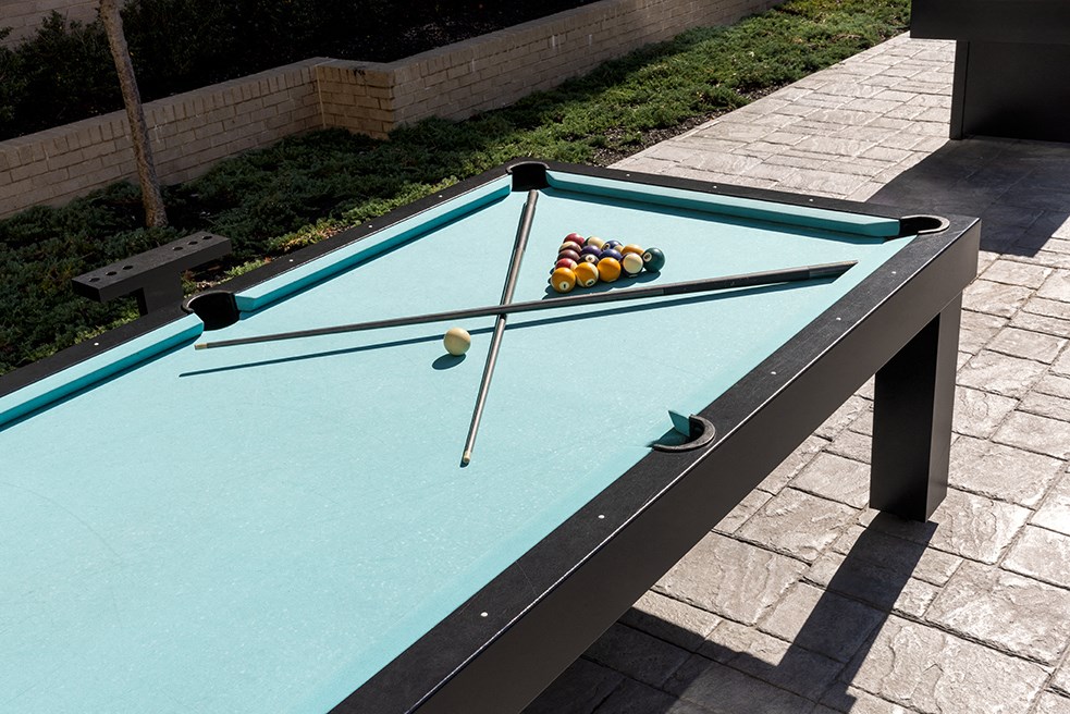 a pool table with balls on it on a patio