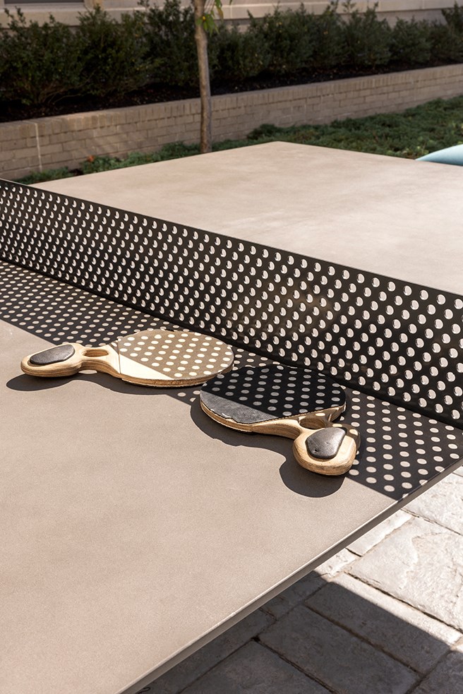 a table with two spoons sitting on top of it