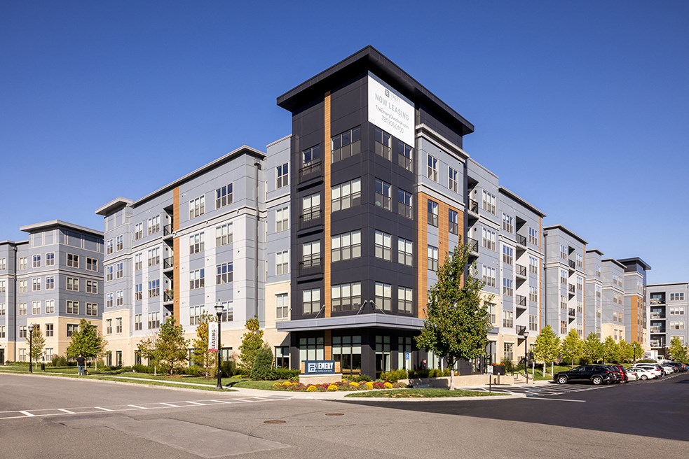 a rendering of an apartment building on a city street