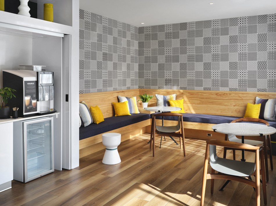 a living room with a couch and a table and a microwave