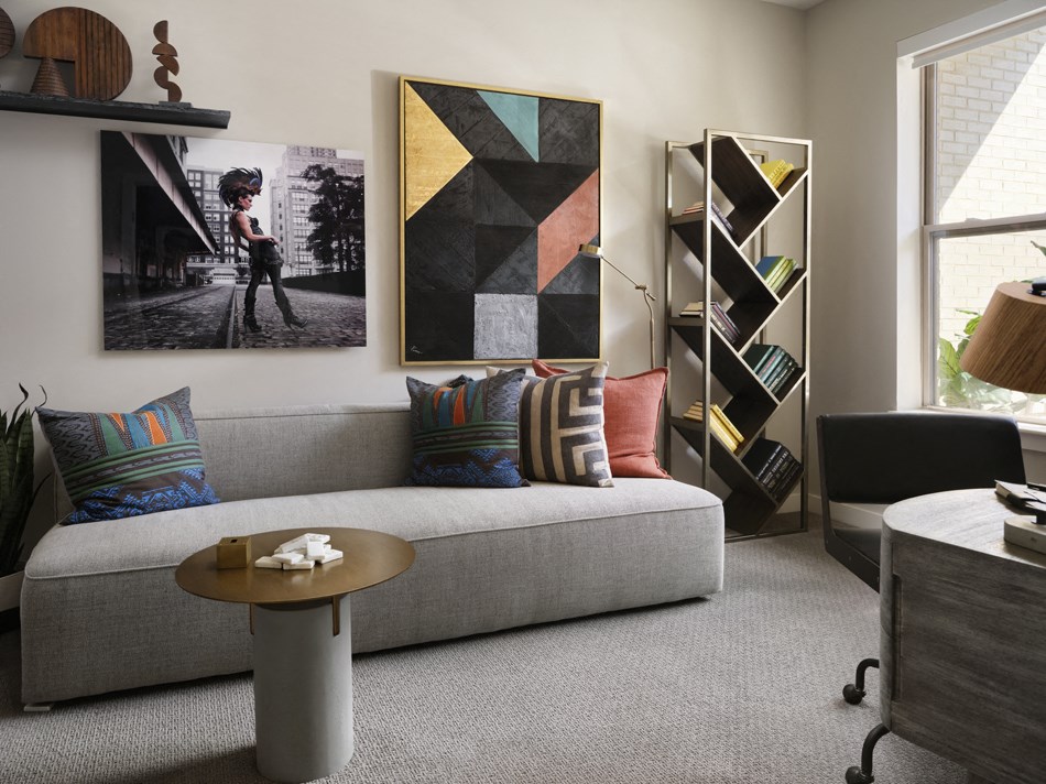 a living room with a gray couch and a coffee table