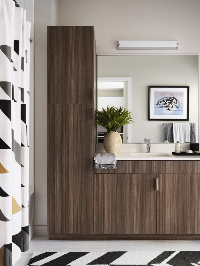 a bathroom with a wooden cabinet and a sink