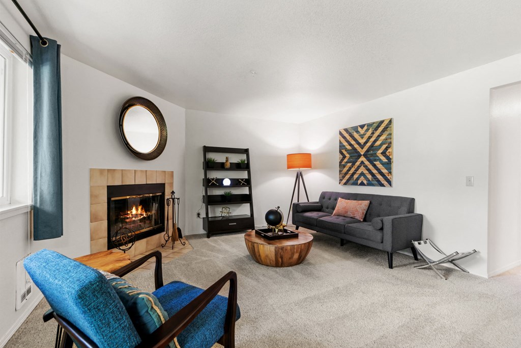 a living room with a couch and a fireplace