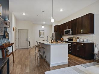 Kitchen with dark cabinets at The Slate at Andover Apartments in Andover MA