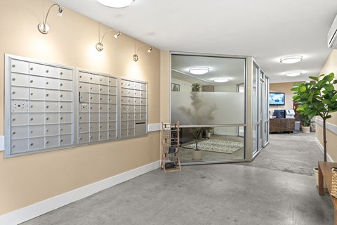 a locker room with lots of mailboxes on the wall