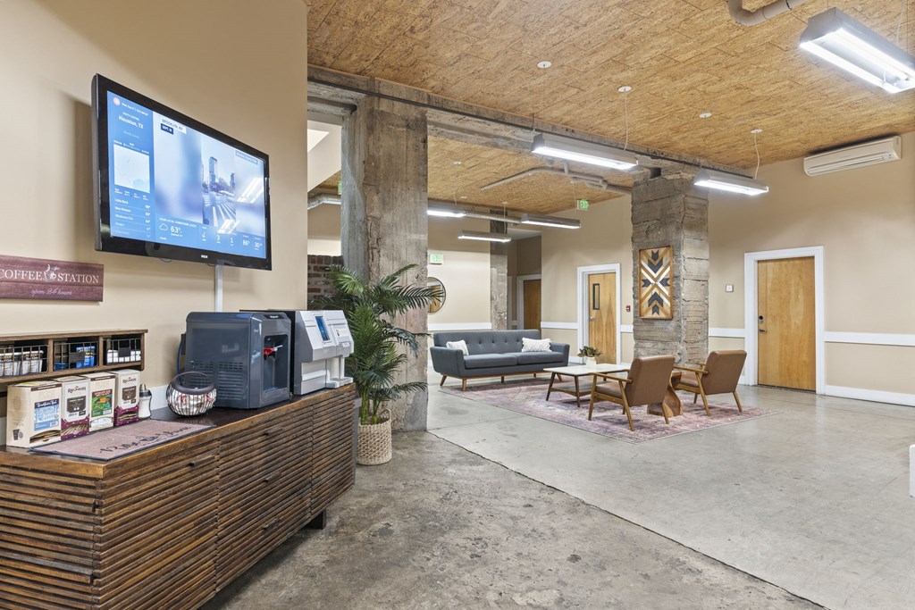 a living room with a tv and a table and chairs