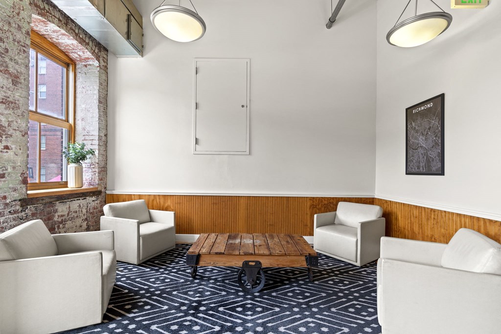 a living room with couches chairs and a table