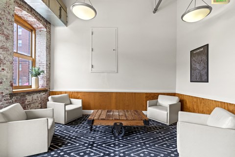 a living room with couches chairs and a table