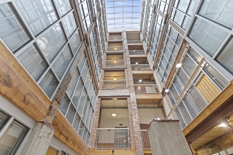 the interior of a building with large glass windows and a staircase