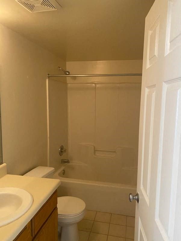 a bathroom with a sink toilet and a shower