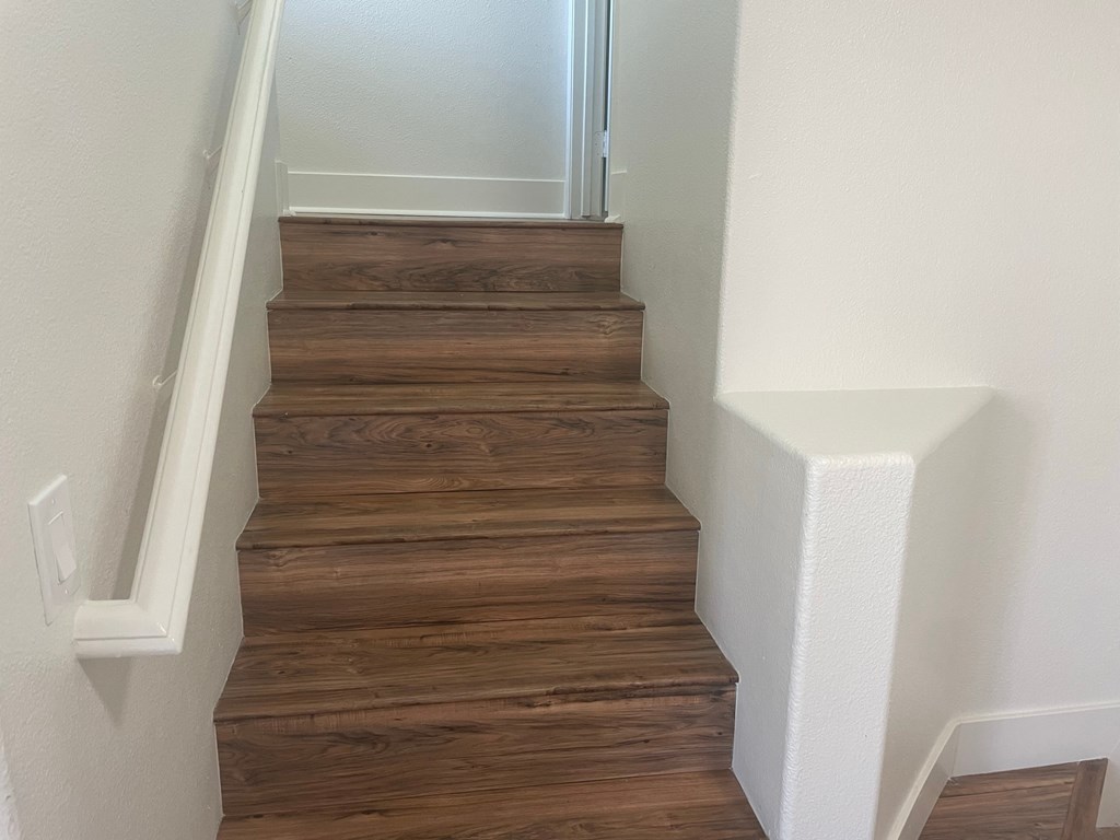 the stairway up to the second floor of a house