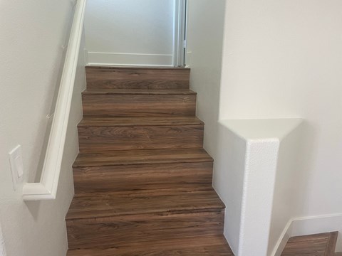 the stairway up to the second floor of a house
