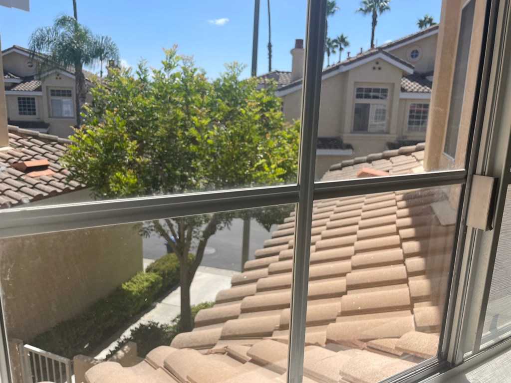 a view from a window of the roof of a house