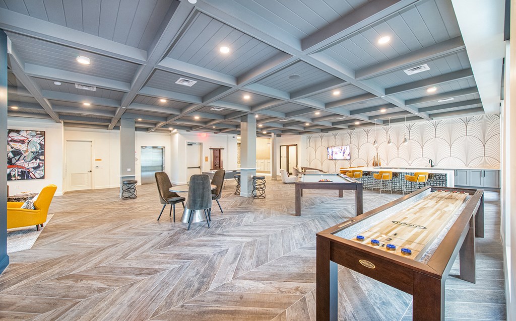 a clubhouse with a pool table and a game room