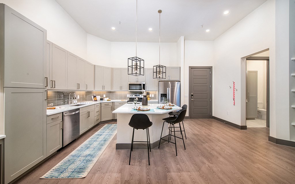 a kitchen and dining area with a table and chairs