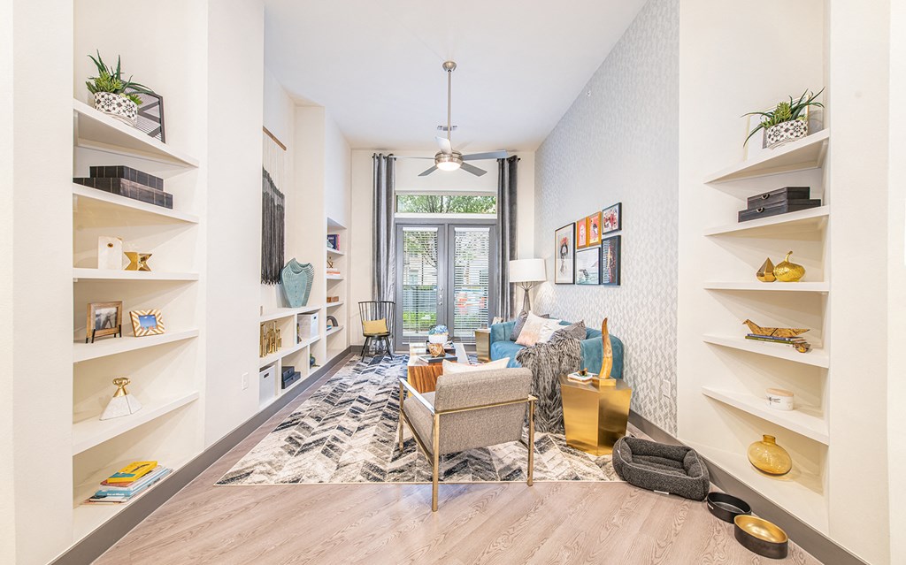 a living room with a couch and a window
