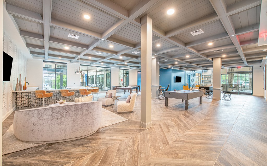 a clubhouse with a ping pong table and a pool table