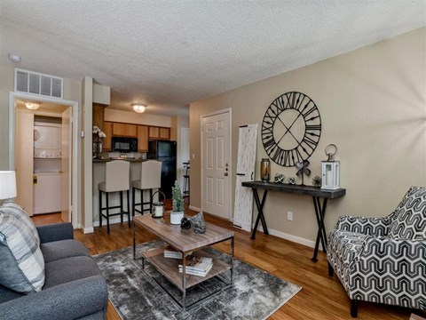 an open living room and kitchen with a couch and a table