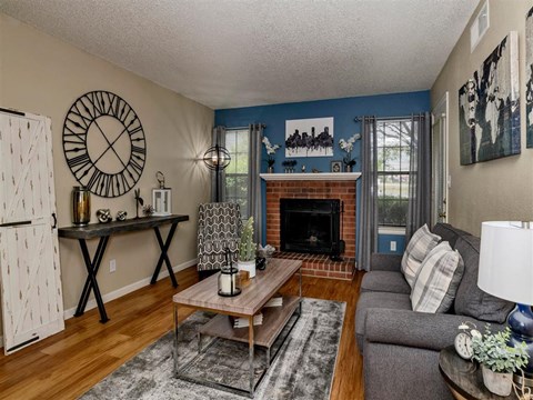 a living room with a couch and a fireplace