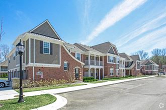 a row of brick houses on the side of a street