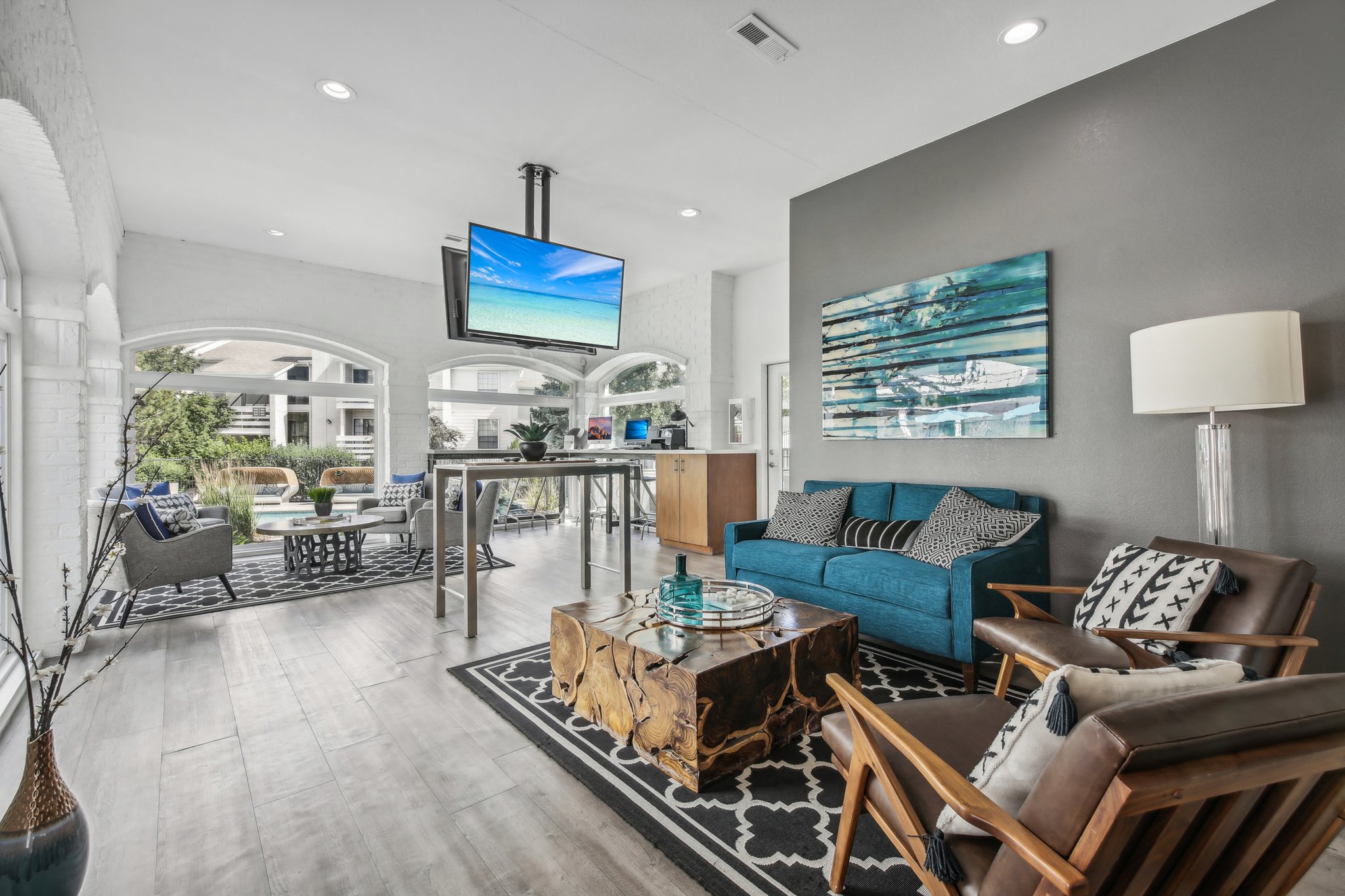 a living room with a blue couch and a table
